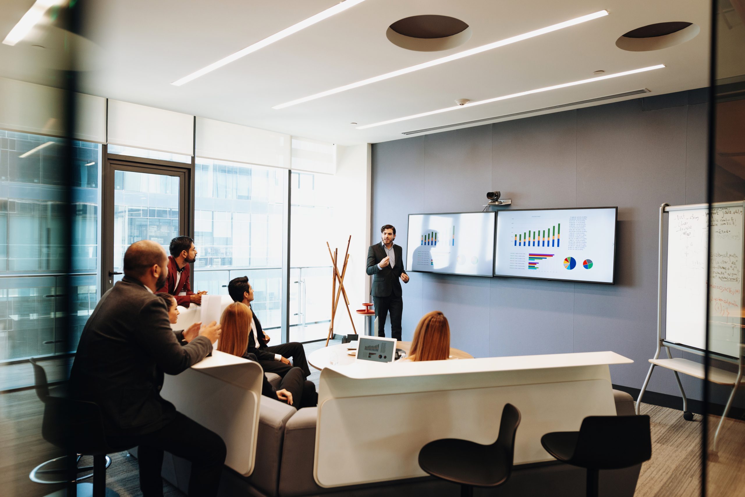 Latin/Hispanic business people in America establishing new contacts, working together and applying academic knowledge to make successful decisions in business.